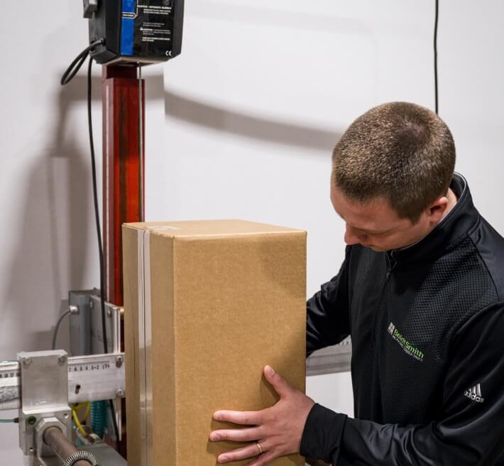 Boldtsmith employee testing a package